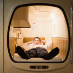 Businessman in a capsule hotel